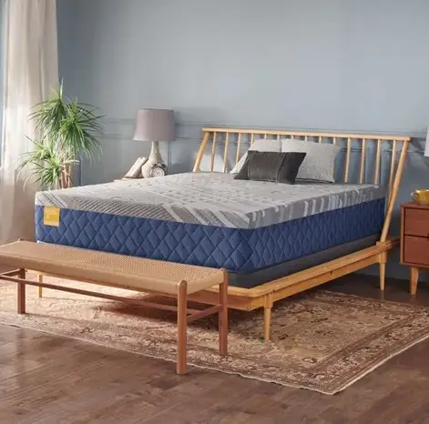 Park Plaza Medium Mattress on a wooden bed frame with a stylish design, featuring SealyComfort gel memory foam and a stretch-knit cover, set in a cozy bedroom environment.
