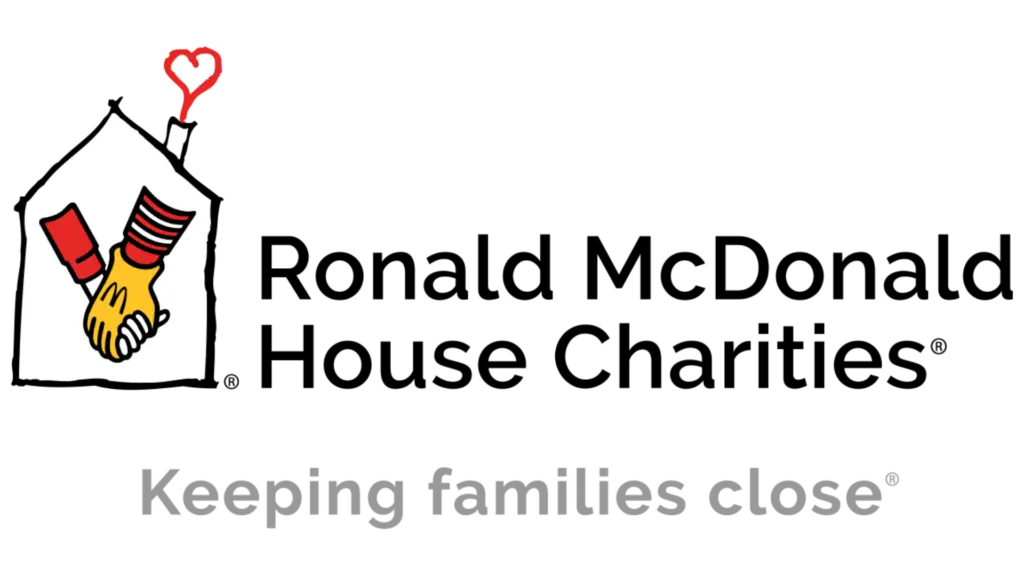 Logo of a community partnership initiative featuring a house, hands shaking, and a heart symbol, representing Jacksonville Bedding's commitment to supporting local non-profits and enhancing community well-being.