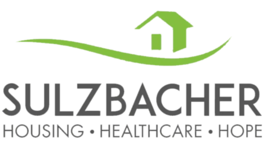 Sulzbacher logo featuring a green house icon and the words "Housing, Healthcare, Hope," symbolizing community support and well-being initiatives in Jacksonville.