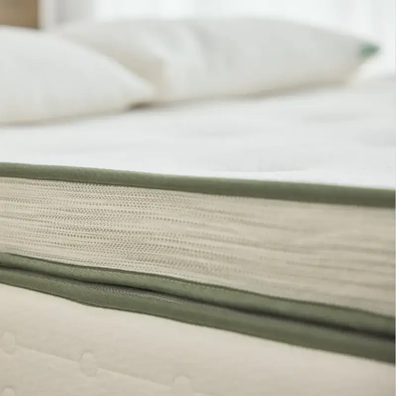 Avocado Green Mattress Box Top showing plush design with organic materials and green trim, emphasizing comfort and sustainability.