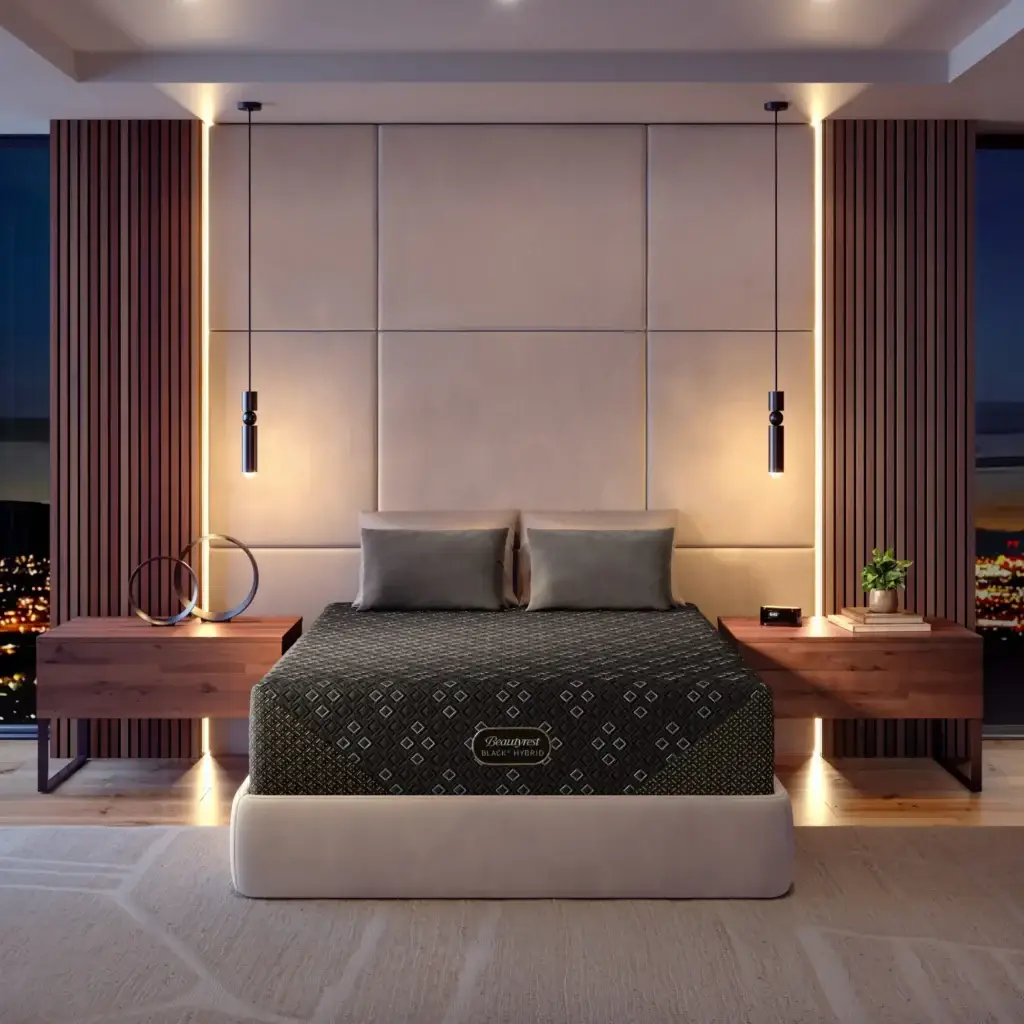 Beautyrest Black Hybrid mattress on a stylish bed in a modern bedroom setting, featuring elegant decor and ambient lighting, showcasing a luxurious sleep experience.