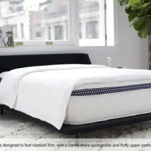 WinkBed Luxury Hybrid mattress on a modern bed frame, featuring a medium-firm design with a fluffy upper portion, ideal for plus firmness preferences.